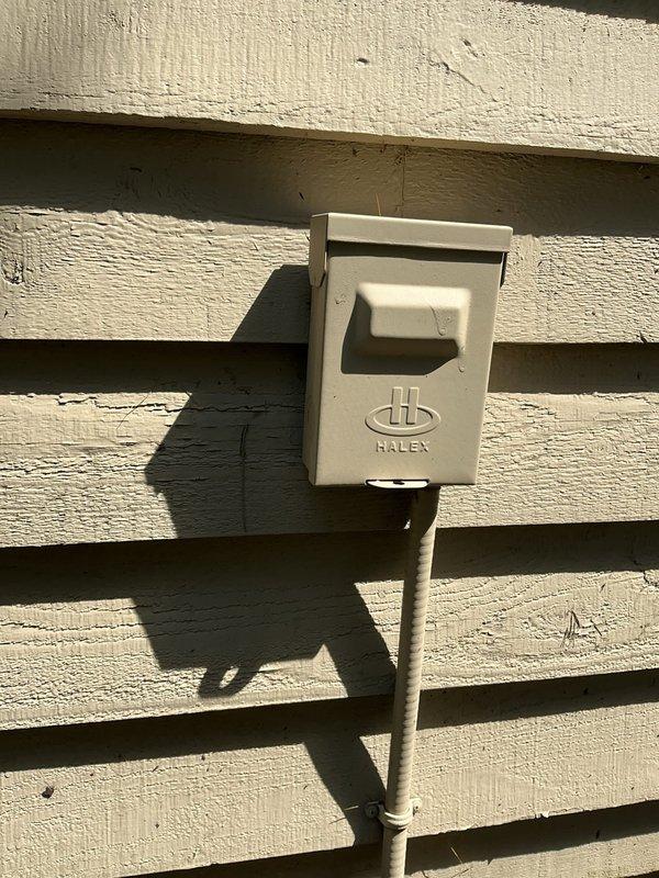 Completed annual maintenance inspection on a 10-year-old air conditioning system. Performed comprehensive tune-up including electrical testing with clamp meter, measuring voltage and amperage readings at the unit's electrical connections to verify proper system operation. Inspected exterior disconnect box and weatherproof electrical components for signs of wear or damage. All readings fell within manufacturer specifications, and system demonstrated proper performance with no deficiencies noted. Unit is operating efficiently with no repairs required at this time.