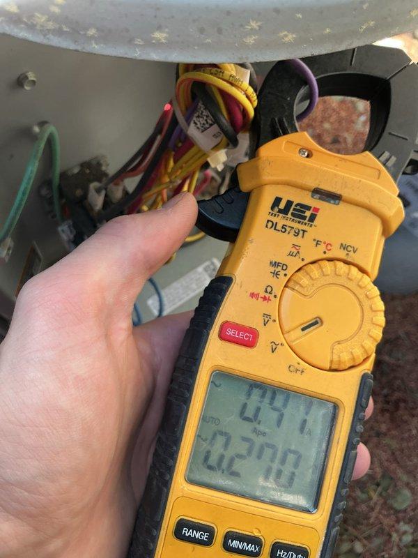 Completed annual maintenance inspection on a 10-year-old air conditioning system. Performed comprehensive tune-up including electrical testing with clamp meter, measuring voltage and amperage readings at the unit's electrical connections to verify proper system operation. Inspected exterior disconnect box and weatherproof electrical components for signs of wear or damage. All readings fell within manufacturer specifications, and system demonstrated proper performance with no deficiencies noted. Unit is operating efficiently with no repairs required at this time.