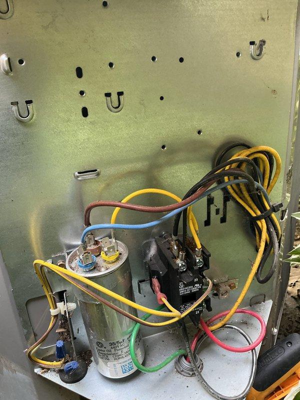Completed routine cooling maintenance on residential air conditioning system. Inspected outdoor condenser unit, verified proper operation of contactor and dual run capacitor, checked all electrical connections and wire terminations for security, and confirmed system cycling properly. Unit operating within normal parameters with no issues found.