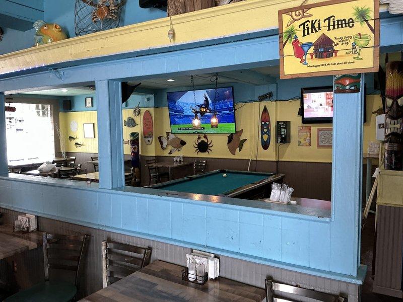 Conducted site assessment at commercial establishment with tropical beach theme for air conditioning options. Customer has existing furnace and requested quote for cooling system, evaluating both mini-split and forced air configurations to determine optimal solution for the space.