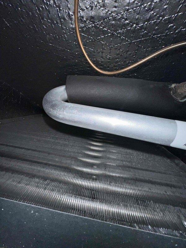 Completed comprehensive cooling system maintenance on residential HVAC unit. Performed thorough inspection of evaporator coil assembly, confirmed proper condensation drainage and verified blower motor operation with squirrel cage fan assembly functioning within normal parameters. All refrigerant lines and insulation intact with no visible defects noted.