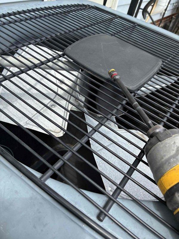 Replaced failed condenser fan motor and dual run capacitor on outdoor HVAC unit. System restored to proper operation with new motor and capacitor installed, all electrical connections secured, and unit tested for proper function.