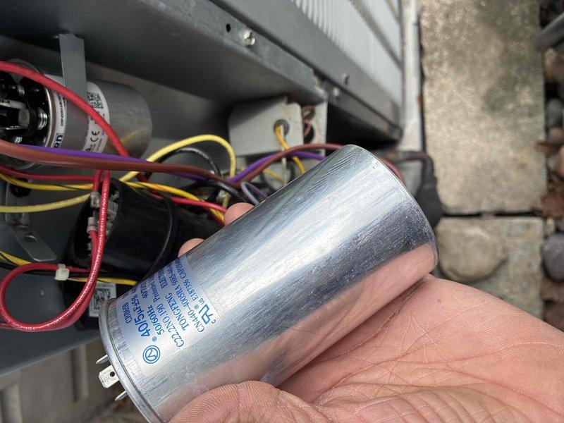 Replaced failed condenser fan motor and dual run capacitor on outdoor HVAC unit. System restored to proper operation with new motor and capacitor installed, all electrical connections secured, and unit tested for proper function.