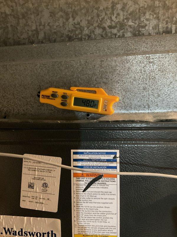 Completed scheduled preventive maintenance on residential HVAC cooling system. Inspected air handler unit in basement utility area, verified proper operation of all components, and confirmed supply air temperature at 48.0°F indicating adequate cooling performance. Checked filter condition, ductwork connections, and overall system integrity with no deficiencies noted.