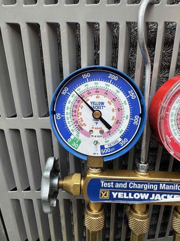 Replaced deteriorated insulation on the outdoor unit's suction line to restore proper thermal efficiency and prevent condensation issues. Leveled the electrical disconnect box to ensure proper mounting and code compliance. Removed the damaged outdoor condenser pad and installed a new replacement pad, leveling it with gravel base for stable equipment support and proper drainage. Performed system diagnostics using manifold gauges to verify refrigerant pressures and confirm proper system operation following the repairs.