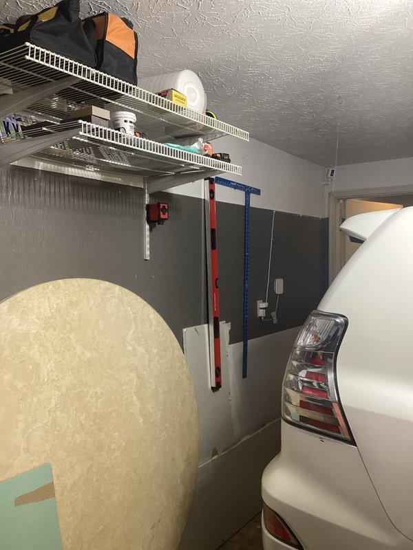 Conducted comprehensive electrical assessment for electric vehicle charging station installation in residential garage. Evaluated existing electrical panel capacity, circuit availability, and optimal mounting location for Level 2 EV charger. Documented current garage electrical infrastructure, including wire routing pathways from main service panel through basement utility area to proposed charging station location. Photographed existing conditions to support load calculation requirements and permit application process for future installation.