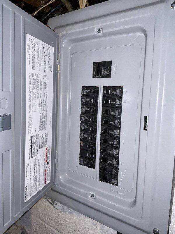 Completed estimate for add-on forced air system installation to existing residential HVAC infrastructure. Assessed electrical panel capacity and confirmed adequate breaker availability for new equipment installation. Determined soft start kit requirement for compressor to reduce inrush current and protect existing electrical service during startup cycles. Documented current mechanical room configuration including water heater, plumbing connections, and existing ductwork routing to plan optimal equipment placement and air distribution pathways.