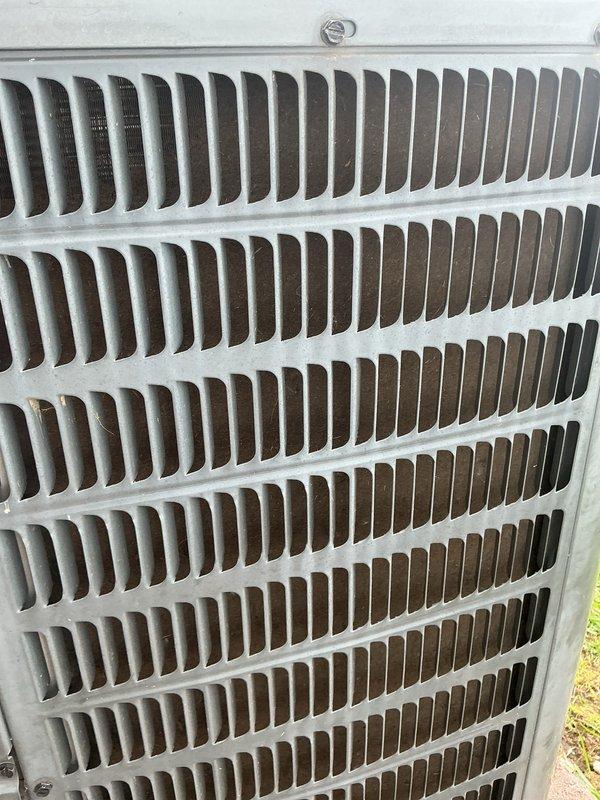 Completed cooling tune-up on Goodman HVAC system, including inspection of indoor furnace unit and outdoor condenser. Performed standard maintenance procedures, checked system operation, inspected air filter assembly, and verified condenser coil condition and airflow through protective grille.