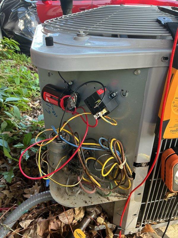 Responded to customer complaint of inadequate cooling in upstairs rooms. Upon arrival, performed diagnostic assessment of outdoor condensing unit. Connected manifold gauge set to measure refrigerant pressures and evaluate system performance. Inspected electrical components including capacitor and wiring connections with access panel removed. System evaluation completed to determine root cause of insufficient airflow to secondary zones.