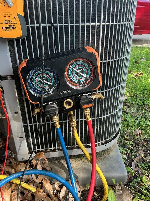 Responded to customer complaint of inadequate cooling in upstairs rooms. Upon arrival, performed diagnostic assessment of outdoor condensing unit. Connected manifold gauge set to measure refrigerant pressures and evaluate system performance. Inspected electrical components including capacitor and wiring connections with access panel removed. System evaluation completed to determine root cause of insufficient airflow to secondary zones.