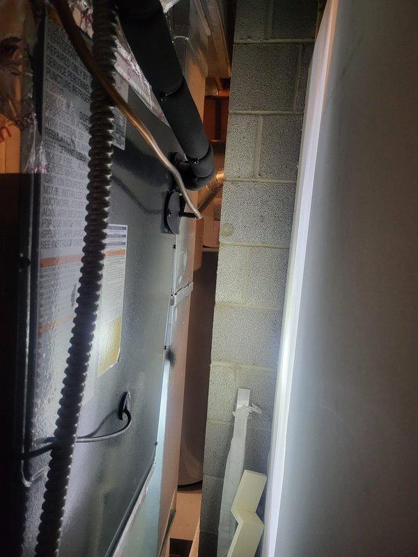 Completed installation of new A2L refrigerant heat pump air conditioning system in basement utility area. Installed indoor air handler unit with proper electrical connections, refrigerant line sets, and condensate drainage, ensuring all components meet current safety and efficiency standards per manufacturer specifications.