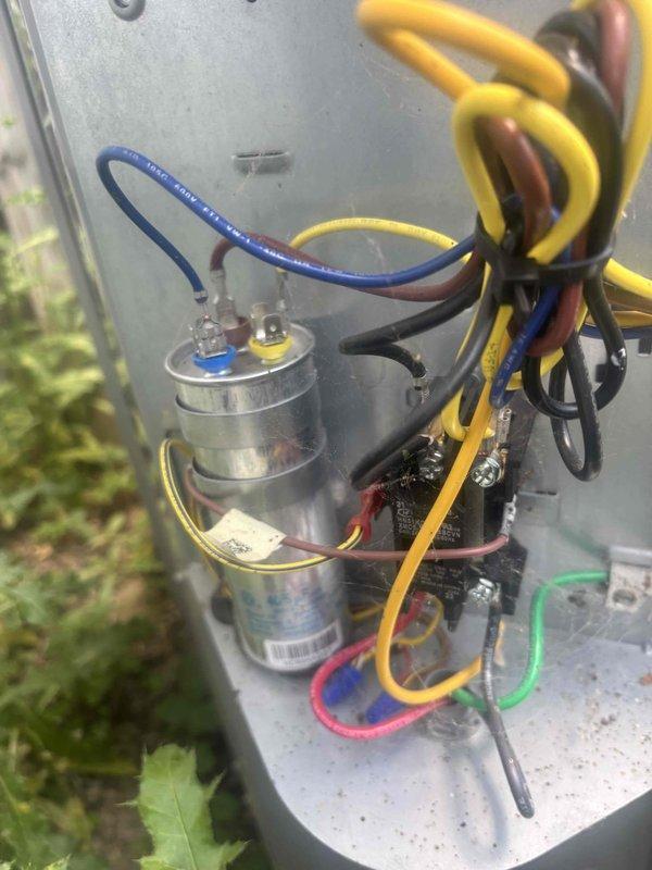 Performed comprehensive cooling system tune-up on outdoor HVAC unit. Inspected and tested electrical components including dual capacitors and contactor assembly, verified all wire connections and terminals for proper seating and condition, and confirmed system operational readiness for continued cooling season performance.