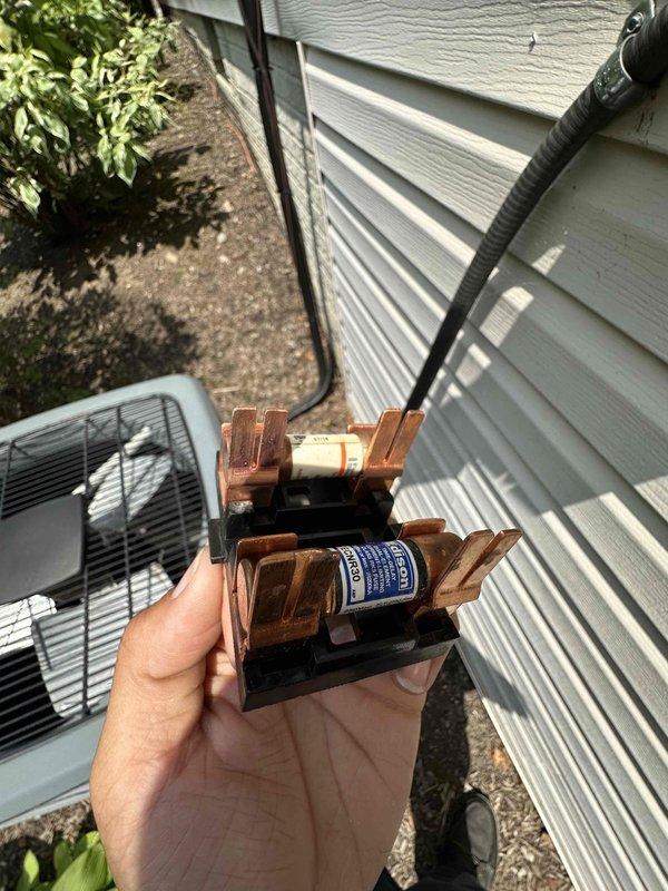 Completed routine cooling season maintenance on residential air conditioning system. Performed electrical diagnostics using clamp meter to verify proper amperage draw and system performance, inspected and tested disconnect block with cartridge fuses for secure connections and proper operation. All components operating within normal parameters, system ready for cooling season demands.