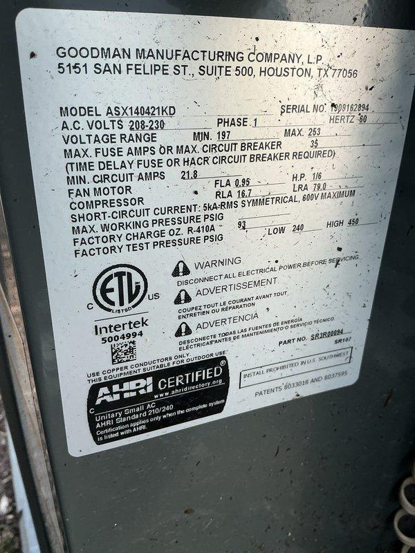 Responded to customer complaint of excessive noise from 5-year-old Goodman ASX140421KD air conditioning unit. Performed diagnostic inspection of outdoor condensing unit and verified manufacturer specifications on data plate. Measured operating amperage at 10.65 amps, which falls within normal parameters for the compressor and fan motor (MCA 21.8A, RLA 16.7A). Conducted visual and auditory assessment of unit during operation to identify source of increased noise levels. System confirmed to be running with proper electrical draw and R-410A refrigerant charge as indicated on nameplate. Documented equipment condition and operational readings with photographs for service records.