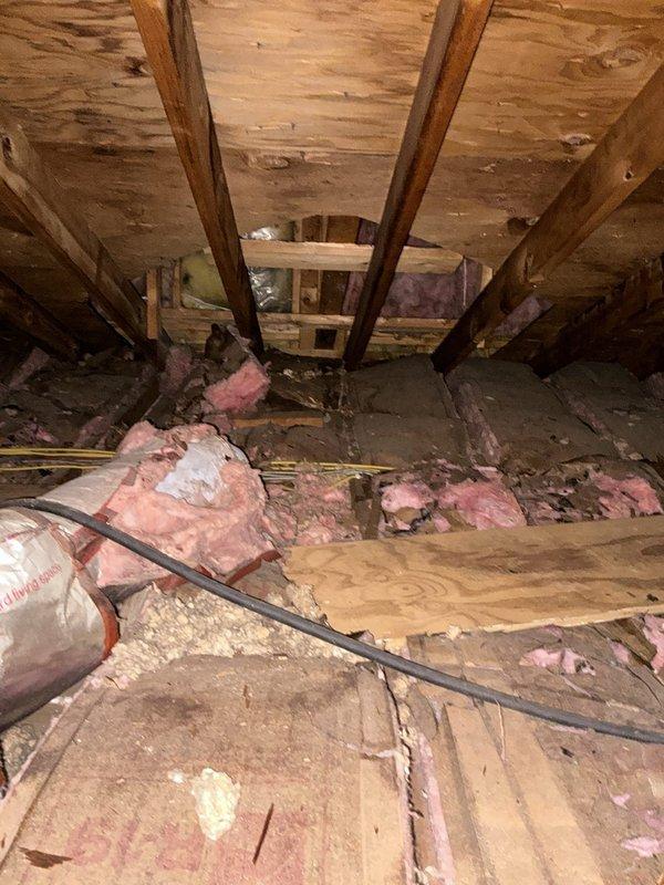 Conducted comprehensive assessment for full HVAC system replacement with heat pump conversion. Existing system completely non-operational, requiring total equipment replacement. Evaluated attic installation area, documenting current conditions including exposed ductwork access points and insulation status. Assessed exterior equipment placement location at building corner near existing downspout and utility connections. Provided detailed quote for complete heat pump system installation including indoor air handler, outdoor condensing unit, refrigerant lines, electrical requirements, and necessary modifications to accommodate heat pump operation. Documented existing infrastructure and recommended improvements to insulation and attic space preparation for optimal system performance.