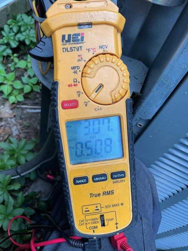 Completed annual preventative maintenance tune-up on residential air conditioning system. Performed comprehensive inspection of outdoor condensing unit, verified proper operation of all components, and measured system capacitance reading of 30.0 MFD with line voltage at 705.79 using digital multimeter. Unit operating within normal parameters with no issues found; system confirmed ready for cooling season.