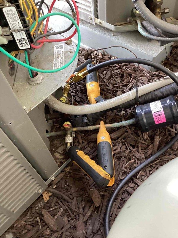 # HVAC Repair Completed

Replaced failed evaporator A-coil due to refrigerant leak not covered under warranty. Removed old coil, installed new replacement unit, and recharged system with approximately 4-5 pounds of refrigerant. Performed system diagnostics and temperature verification, confirming proper airflow and cooling performance with supply air temperature reading of 62.8°F at register. All refrigerant lines properly connected and insulated, system tested and operational.