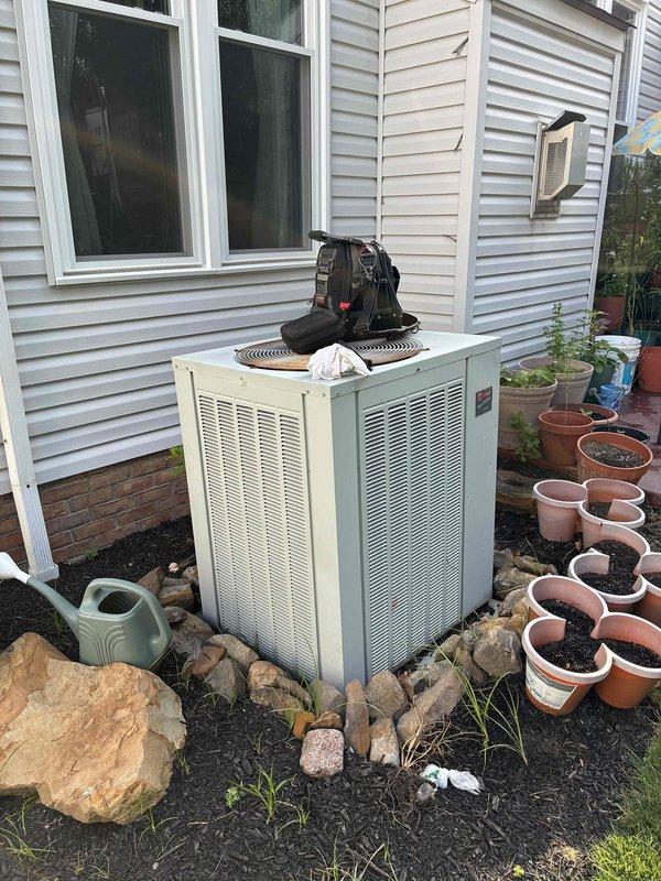 Completed scheduled preventive maintenance on residential cooling system. Performed comprehensive inspection of outdoor condenser unit, verified system operation with digital temperature readings showing 71°F, and documented equipment condition. All components found operating within normal parameters with no immediate service needs identified.