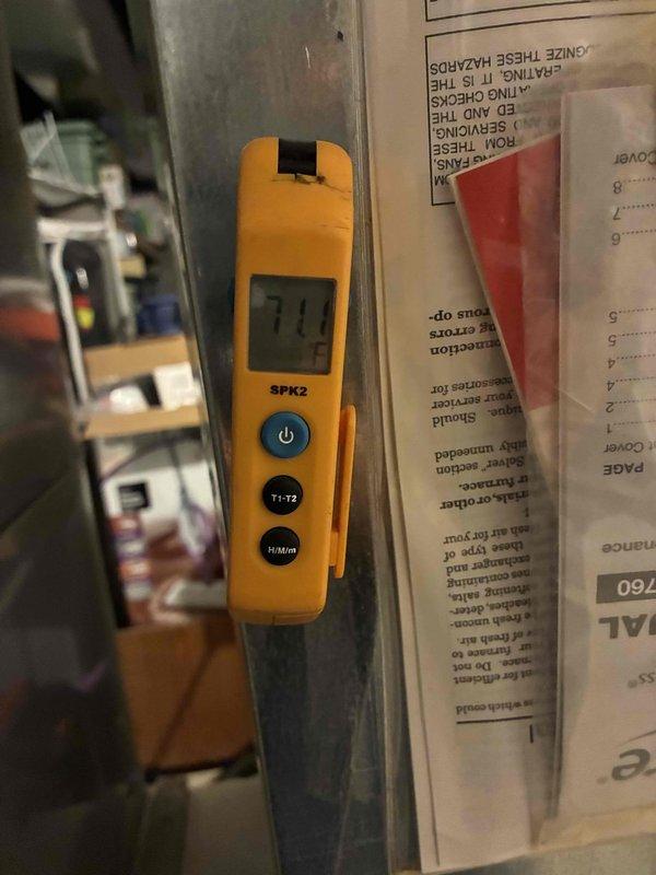 Completed scheduled preventive maintenance on residential cooling system. Performed comprehensive inspection of outdoor condenser unit, verified system operation with digital temperature readings showing 71°F, and documented equipment condition. All components found operating within normal parameters with no immediate service needs identified.