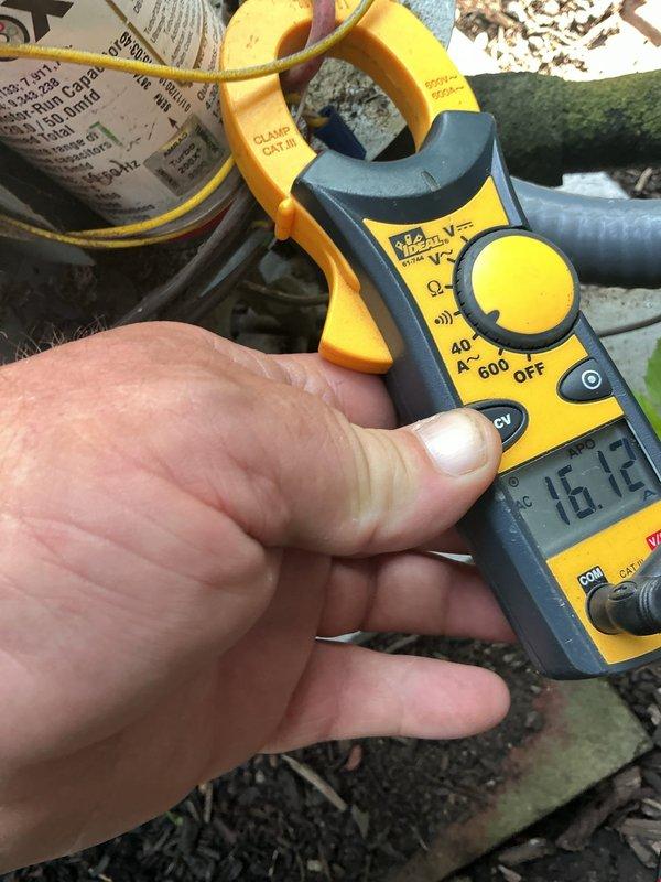 Completed scheduled preventive maintenance on residential cooling system. Performed electrical diagnostics using clamp meter to verify compressor amperage draw at 16.12 amps, confirming unit operation within manufacturer specifications. Inspected condenser unit exterior components including protective fan grille and housing for proper condition and airflow clearance.