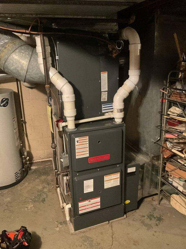 Completed cooling maintenance on residential HVAC system including furnace and air handler unit located in basement utility area. Installed new M8-1055 pleated air filter (20 1/4" x 25 3/8" x 5") as requested and replaced thermostat batteries. Inspected all mechanical components, refrigerant lines, condensate drain lines, and electrical connections; confirmed system operating within normal parameters.