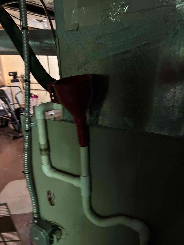 Performed routine maintenance on 20-year-old HVAC system including filter replacement and comprehensive system inspection. Measured operating amperage at 13.11A and voltage at 0.300V using digital multimeter to verify electrical performance. System found operating within normal parameters with no issues identified during tune-up service.