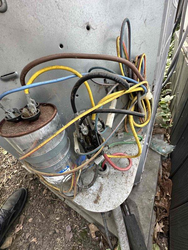 Completed comprehensive cooling season tune-up on outdoor condensing unit. Performed standard maintenance procedures including electrical testing with clamp meter showing 14.0 amp draw, inspected refrigerant lines and electrical connections, and verified proper system operation. Unit found to be functioning within normal parameters with all components operating as designed.
