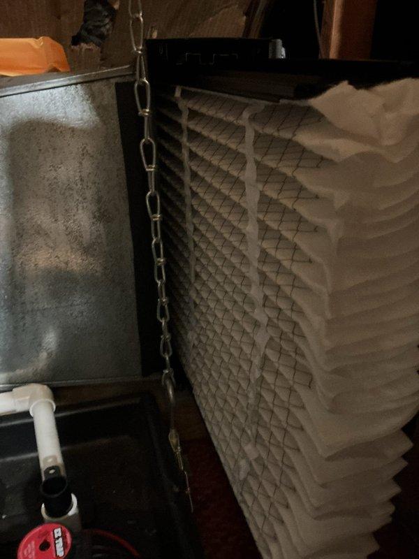 Responded to service call and accessed property through side door as arranged. Removed heavily soiled pleated air filter from HVAC system showing significant dust and debris accumulation. Installed new replacement filter to restore proper airflow and system efficiency. System operational upon completion.