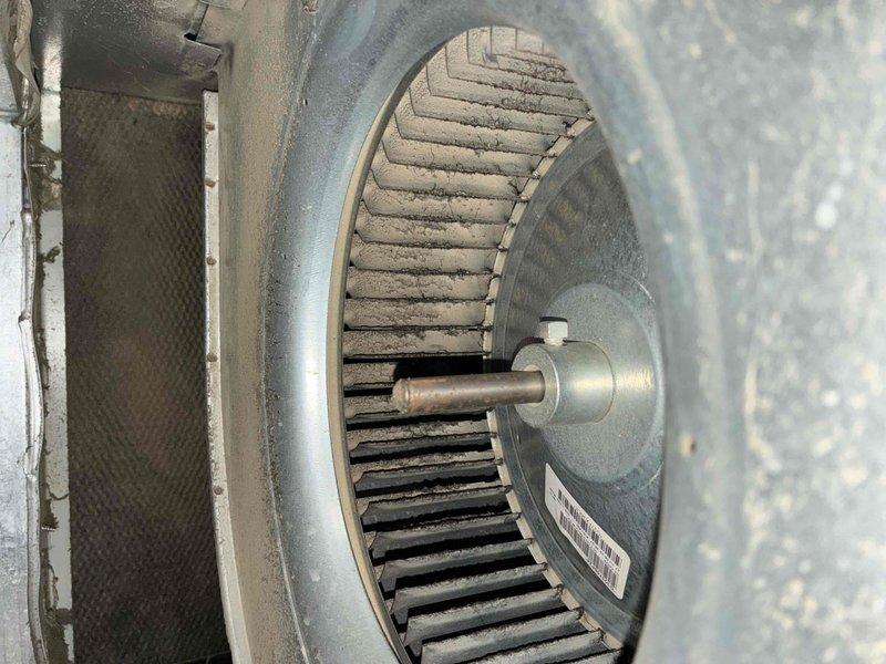 Responded to service call for thermostat displaying error message and unable to read outdoor temperature. Upon inspection, found blower wheel assembly heavily soiled with dust and debris accumulation affecting system operation. Measured supply air temperature at 53.1°F to verify cooling functionality. Diagnosed thermostat communication issue related to outdoor sensor malfunction and addressed system airflow concerns due to contaminated blower wheel and filter media requiring maintenance.