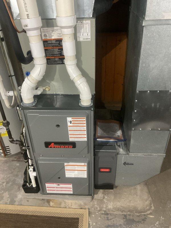 # HVAC Cooling Maintenance Summary

Completed routine cooling system maintenance on residential Amana HVAC unit located in basement utility area. Performed comprehensive inspection of furnace and air conditioning components, verified proper operation of all system controls, and documented temperature readings at supply ductwork measuring 55°F, confirming adequate cooling performance.

# Detailed Service Report

Performed seasonal preventive maintenance on residential forced-air cooling system with Amana brand equipment. Conducted thorough visual inspection of furnace cabinet, verifying all manufacturer labels and safety warnings remained intact and legible. Inspected PVC intake and exhaust vent piping for proper connections, secure mounting, and absence of blockages or damage.

Examined sheet metal ductwork connections to main unit, confirming structural integrity and proper sealing at joints. Verified electrical connections and copper refrigerant lines showed no signs of damage, corro