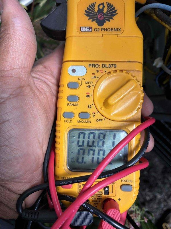 Completed seasonal cooling tune-up on HVAC system. Performed electrical diagnostics using digital multimeter to verify proper voltage and capacitance readings. Inspected blower assembly and noted moderate dust accumulation on squirrel cage fan blades and housing, which is normal for seasonal maintenance interval.