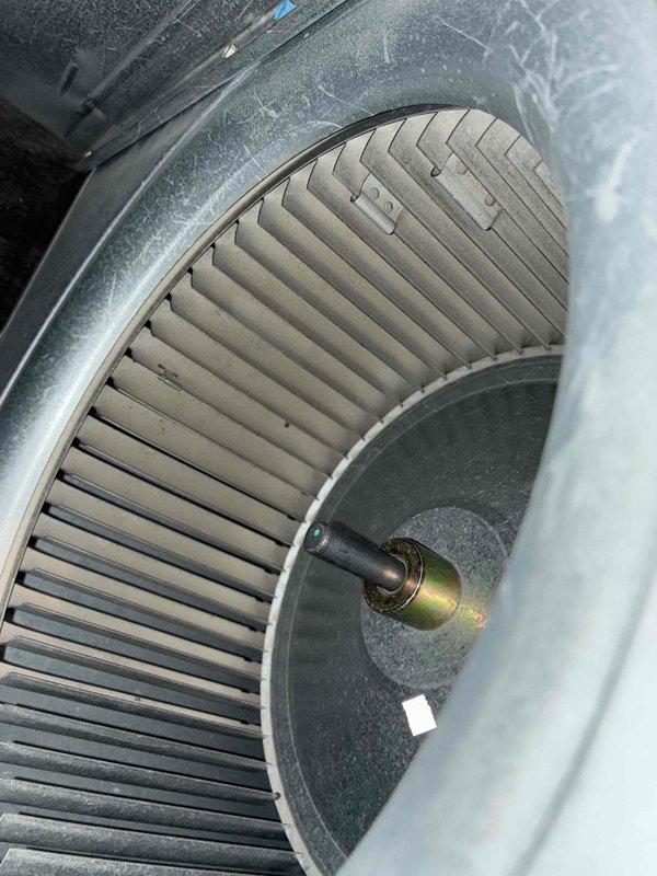Completed seasonal cooling tune-up on HVAC system. Performed electrical diagnostics using digital multimeter to verify proper voltage and capacitance readings. Inspected blower assembly and noted moderate dust accumulation on squirrel cage fan blades and housing, which is normal for seasonal maintenance interval.