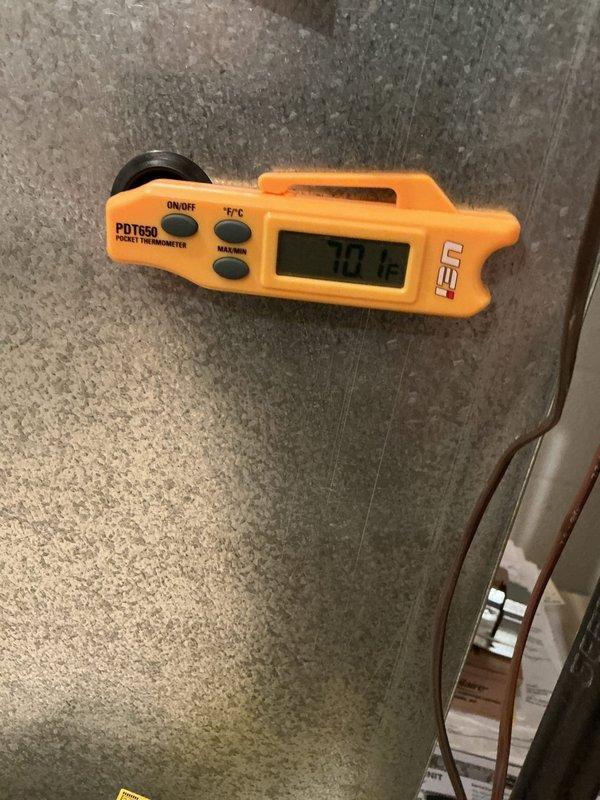 Completed annual cooling maintenance on residential HVAC system with multiple air conditioning units as part of preventive maintenance program. Accessed equipment through garage entry, performed comprehensive inspection of furnace, air handler, and associated electrical components, verified system temperatures and operational parameters, and documented equipment condition with thermal readings showing proper performance at -70.2°F on refrigerant lines.