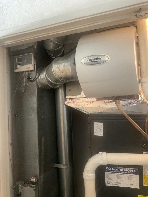 Completed preventive maintenance on residential cooling system. Inspected outdoor condensing unit electrical components including 40/5 MFD dual capacitor, contactor, and associated wiring connections. Verified proper operation of indoor air handler and integrated Aprilaire humidification system. Customer declined optional electrical safety inspection.