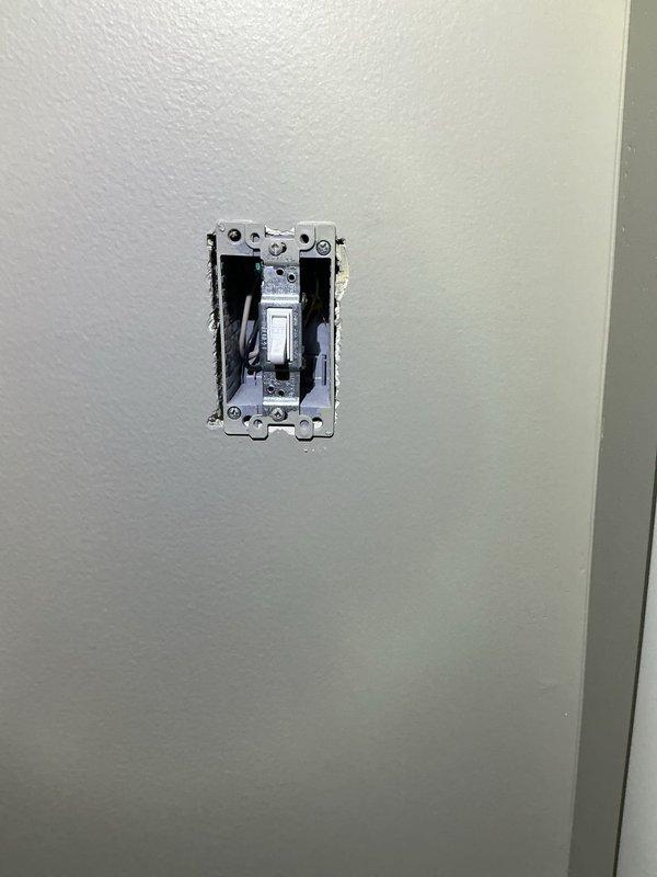 Upgraded existing dryer circuit by running new 4-wire cable from junction box to outlet location. Enlarged wall opening to accommodate updated installation and replaced old outlet with new 4-prong dryer receptacle to meet current electrical code requirements.
