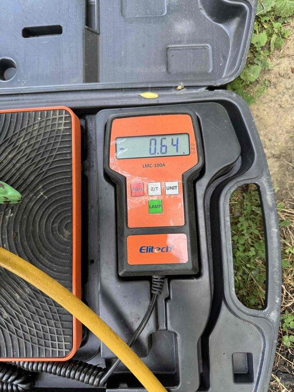 Responded to no cooling complaint on aging air conditioning system. Upon arrival, conducted diagnostic testing of outdoor condensing unit using digital refrigerant leak detector. Equipment showed significant weathering and corrosion on cabinet surfaces, indicating extended service life consistent with 10+ year age. Performed system evaluation to identify root cause of cooling failure.