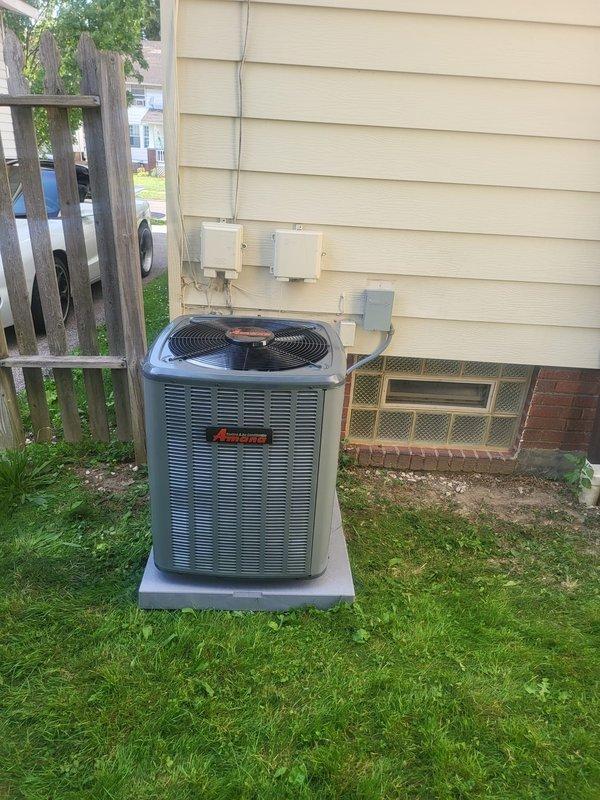 Completed full HVAC system installation including a 96% efficiency furnace, air conditioning unit, and humidifier. Installed Ameristar outdoor condensing unit on concrete pad with proper electrical connections and conduit routing to exterior junction boxes. Mounted and connected indoor furnace and air handler in basement utility area with integrated ductwork, including cylindrical supply plenum and transitions. Installed PVC drainage and venting lines, copper refrigerant lines, and digital thermostat control. System tested and verified operational with all components functioning to manufacturer specifications.