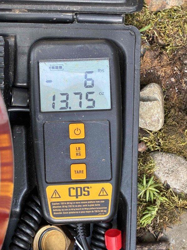 Verified refrigerant charge during coil installation performed by install crew. Measured and documented system charge at 13.75 oz using calibrated digital refrigerant scale to ensure proper levels for optimal system performance and warranty compliance.