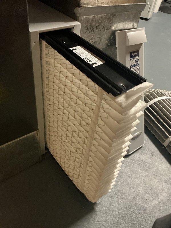 Replaced HVAC air filter with new 20x25 pleated filter to maintain proper system airflow and efficiency. Verified thermostat operation and confirmed system cooling properly at 69 degrees.