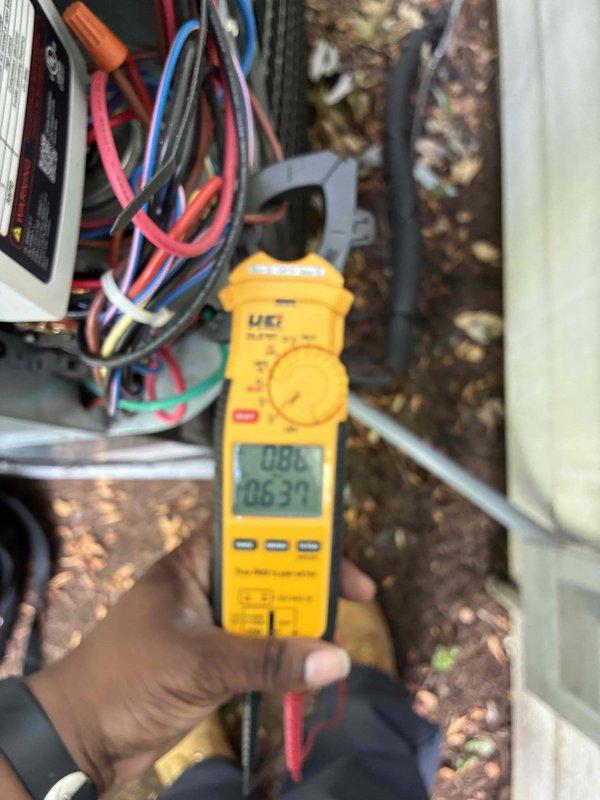 Completed comprehensive cooling season tune-up on 9-year-old residential air conditioning system. Performed electrical diagnostics using digital multimeter to verify proper voltage and amperage readings at control board and compressor circuits, confirmed all connections secure with no anomalies detected. Inspected Trane HVAC unit, condensate drainage system with PVC piping and brass fittings, and associated dehumidifier equipment; all components operating within normal parameters with no issues identified.