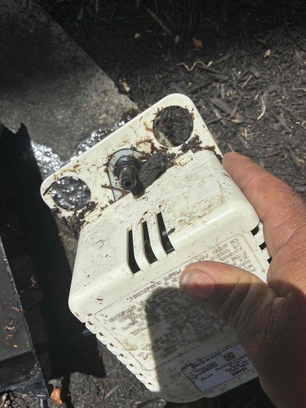 Responded to no cooling complaint and diagnosed failed blower motor assembly with severe corrosion damage to housing and internal components. Removed deteriorated blower unit showing extensive rust on metal framework and cracked plastic housing, replaced with new assembly, and restored proper airflow to system.