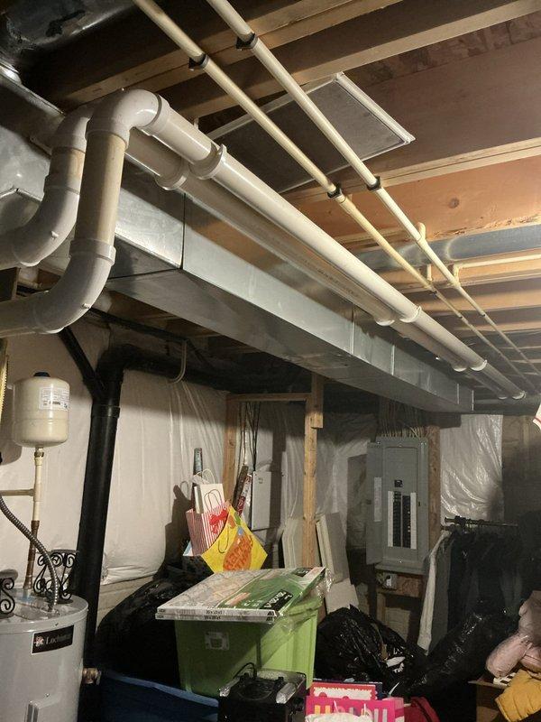 Conducted diagnostic evaluation of existing HVAC system in basement utility area. Assessed current equipment condition, documented system specifications and manufacturer information from unit labels, and provided customer with replacement options based on findings. Repair diagnostic fee applied to service call.