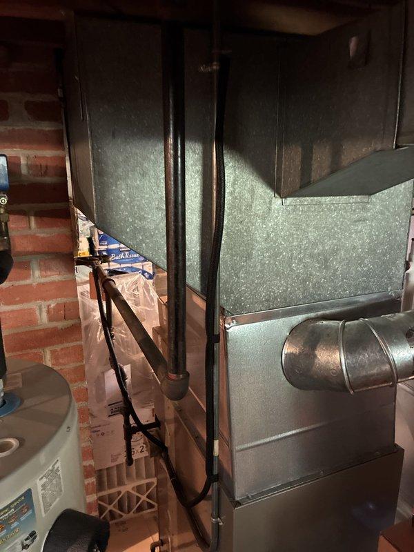 Conducted comprehensive HVAC system replacement estimate in mechanical room with brick wall construction. Evaluated existing furnace installation, documented equipment dimensions and clearances, and prepared detailed technical specifications including cased and uncased configurations with measurements from furnace top to floor level. Provided customer with complete replacement options for both heating and air conditioning systems, including equipment specifications and installation requirements based on current mechanical room layout and ductwork configuration.