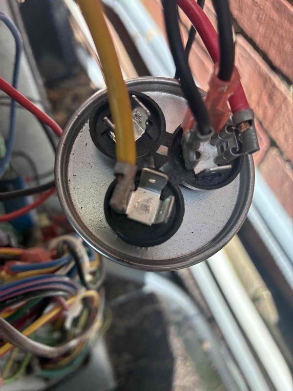 Responded to no cooling call with thermostat displaying "open start circuit" error. Upon inspection, tested the run capacitor using a digital MFD tester which confirmed capacitor failure with abnormal readings. Replaced defective dual run capacitor, verified all electrical connections were secure, and confirmed system returned to normal operation with error cleared.
