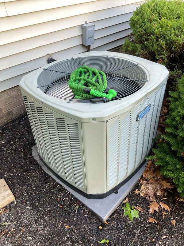 Performed cooling season tune-up on residential air conditioning system. Customer reported previous metal-on-metal contact sound from loose grate screws, which had since resolved, and requested maintenance check as unit had not been serviced recently. Inspected electrical connections and contactor within control panel, verified proper wiring and component operation. Examined outdoor condensing unit, confirmed proper installation on pad with adequate clearance for airflow. System found operating normally with no immediate concerns noted at time of inspection.
