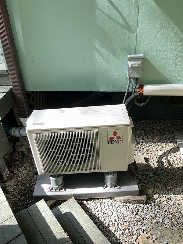 Completed estimate for Mitsubishi Electric mini-split system replacement. Evaluated existing outdoor condenser unit mounted on concrete pad with proper electrical disconnect and refrigerant line connections, and assessed corresponding indoor air handler with electrical panel integration including dedicated circuit breaker installation.