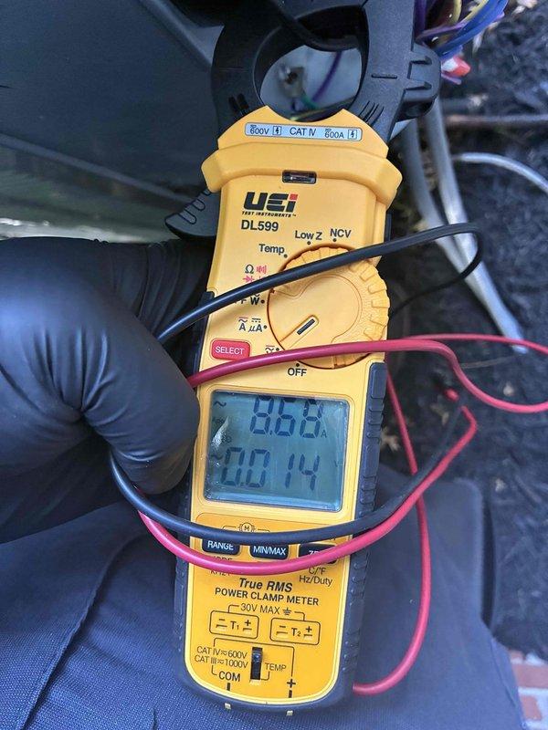 Responded to callback for recurring noise issue following previous service visit. Performed diagnostic evaluation of air conditioning system using clamp meter to measure electrical parameters. Recorded voltage and amperage readings at multiple test points to assess compressor and electrical component performance. Documented system operating conditions with detailed measurements to identify source of abnormal noise complaint.