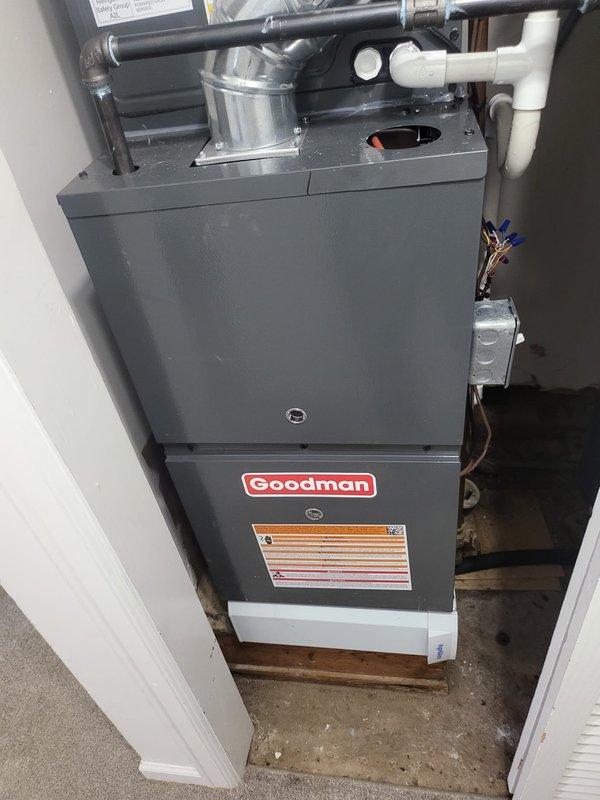 Completed installation of Goodman heat pump system including outdoor condensing unit and indoor furnace. Outdoor unit was mounted on concrete pad with proper clearances, refrigerant lines were run with insulation and connected, electrical disconnect installed, and condensate drain line plumbed with PVC. Indoor furnace was installed in mechanical closet with all necessary electrical connections, control wiring, and venting completed. System was charged, tested, and verified operational.