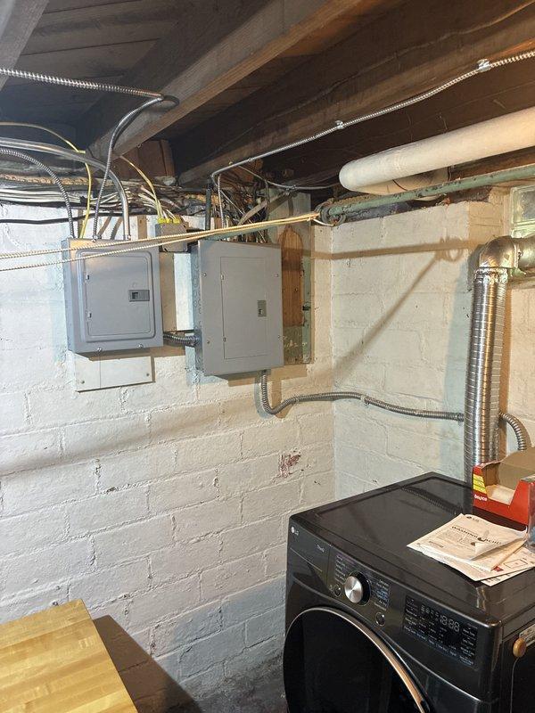 Completed installation of ductless mini-split heat pump system with indoor wall-mounted air handler unit installed in living space and line set routed through basement utility area to outdoor condenser location. Electrical connection deferred to scheduled follow-up appointment per customer coordination requirements.