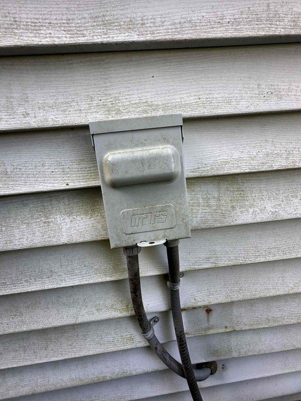 Completed routine HVAC cooling system maintenance inspection. Verified electrical disconnect box and conduit connections at exterior unit, confirming proper operation and accessibility for emergency shutoff. All components functioning within normal parameters with no immediate service needs identified.